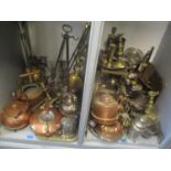 A large selection of metalware to include Victorian copper kettles, brass candlesticks, jelly mould,