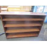 A 1930's oak four tier bookcase 107 h x 142cm w