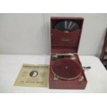A Maxitone wind up gramophone with a small group of 78 rpm records