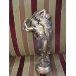 A composition figural group painted in a bronze coloured finish with imprints ROM