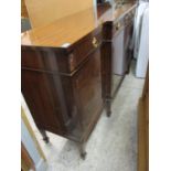 A mahogany twin pedestal dining table top, a breakfront sideboard, coffee table, Edwardian