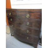 A George III mahogany bowfront chest of two short and three long graduating drawers on splayed legs