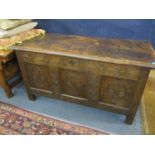 Circa 1650's, a carved oak and tri-panelled coffer with candle box incorporated, 53cm x 110cm x 51cm