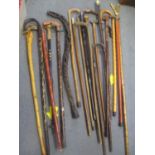 Mixed walking sticks to include a military swagger stick and others