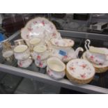 A Royal Albert Tenderness six setting tea service together with five Czechoslovakian coffee cans and