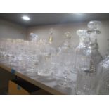 A selection of cut glassware including ring turned decanters and others