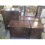 A Stag mahogany bedroom suite consisting of a dressing table and three chests of drawers