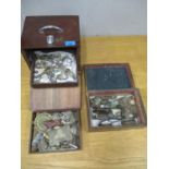 Two boxes of metal detector finds including military buttons, a whistle, bullets, some silver