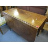 An early 20th century mahogany dining table with drop leaves, 73 h x 107 w x 50cm d (unextended) and