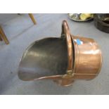 An early 20th century copper coal bucket