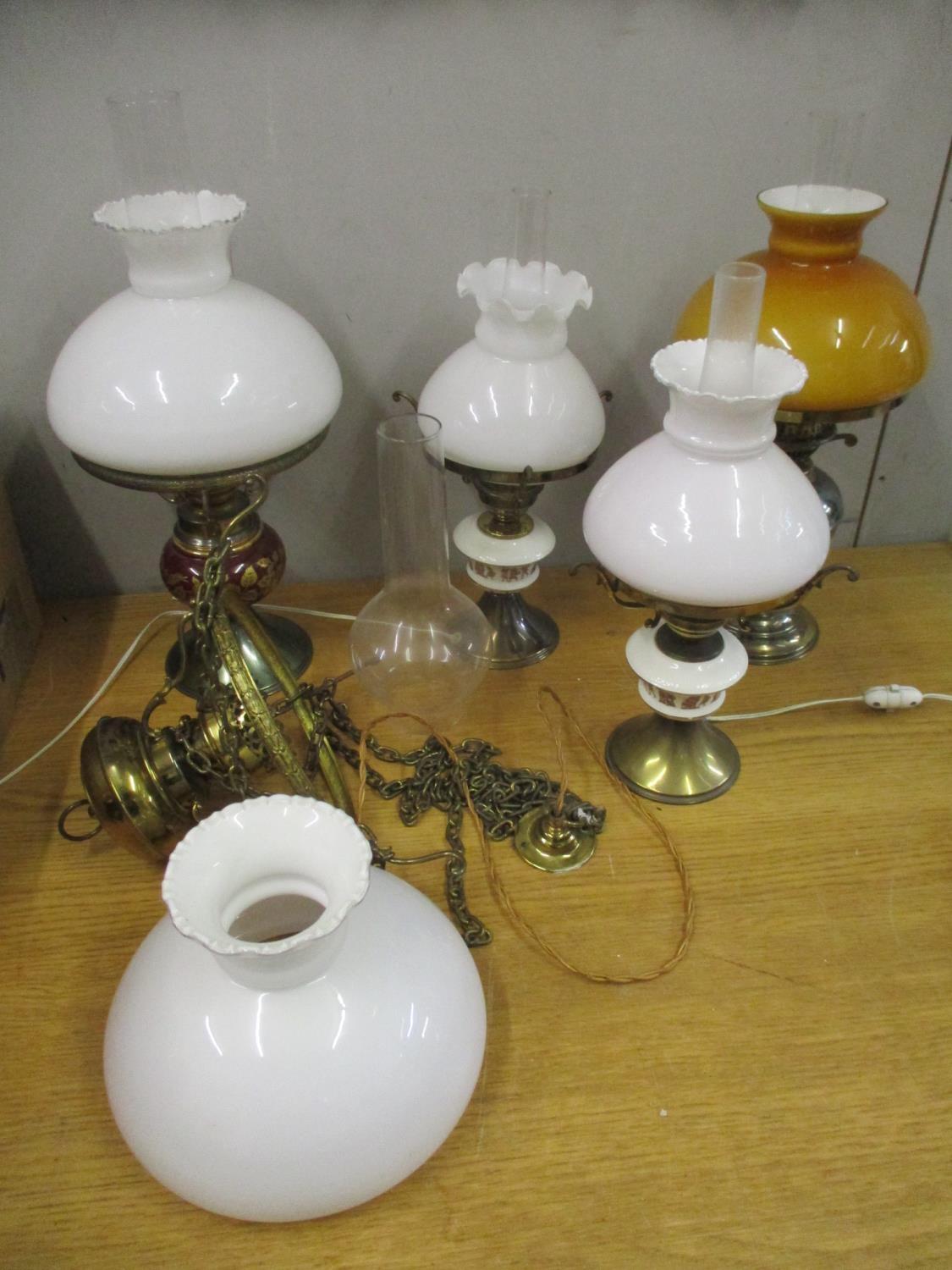 A Duplex oil lamp (converted to electricity) with glass shade and smoke funnel, three other table