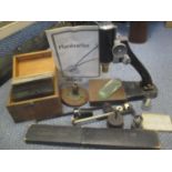 Old microscope parts, glass negatives of microscope specimen slides, slide rule and Plainmeter