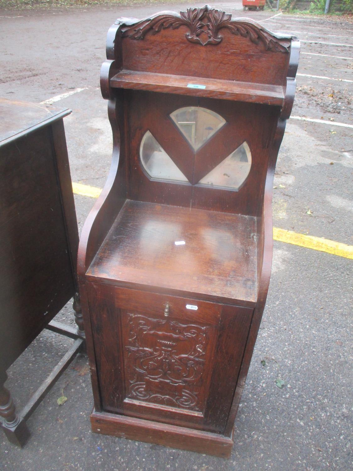 A Victorian oak coal purdonium having a raised mirrored back 115cm h x 42cm w