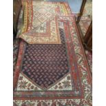 A Kelim rug having a terracotta ground with diamond and geometric design, 167cm x 185cm together