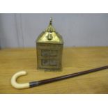 A brass arts and crafts style lantern, an ivory handled walking stick with an exotic hardwood shaft,