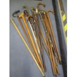 Mixed walking sticks to include one with an antler handle, taxidermy horn handled stick and others