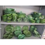 A quantity of Portuguese Cabbage ware, matched, to include eighteen dinner plates, two tureens, jugs