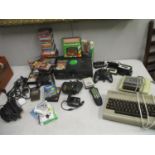 a selection of computer games - An Xbox, a Commodore 64 and a PS2 with various computer games,