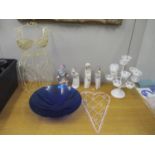 Group of one Lladro and three Nao porcelain figurines, a blue glass bowl and various wine rack