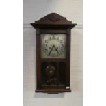 A mid 20th Century Mahogany Wall Clock, 63cm high