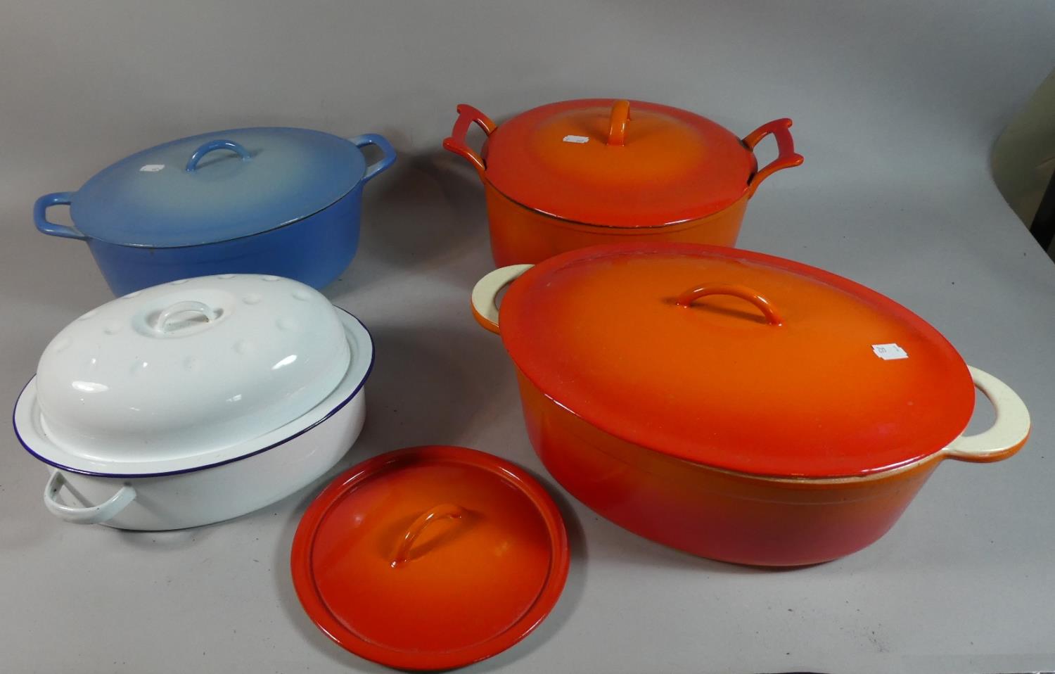 A Collection of Various Enamelled Lidded Cooking Pots and an Enamelled Roasting Tin