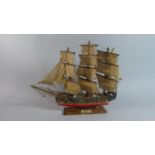 A Wooden Model of a Three Masted Brigantine, 43cm Wide