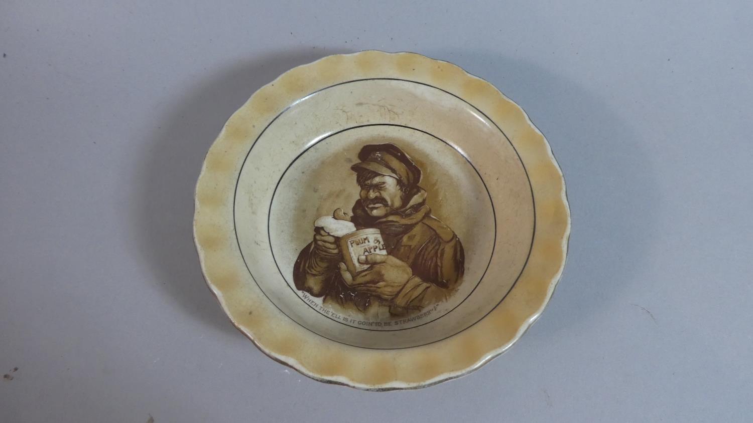 A WWI Grimwades Bruce Bairnsfather Decorated Bowl, 'When the 'ell is it Goin' to Be Strawberry',