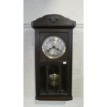 An Edwardian Oak Cased Wall Clock, 68cm high