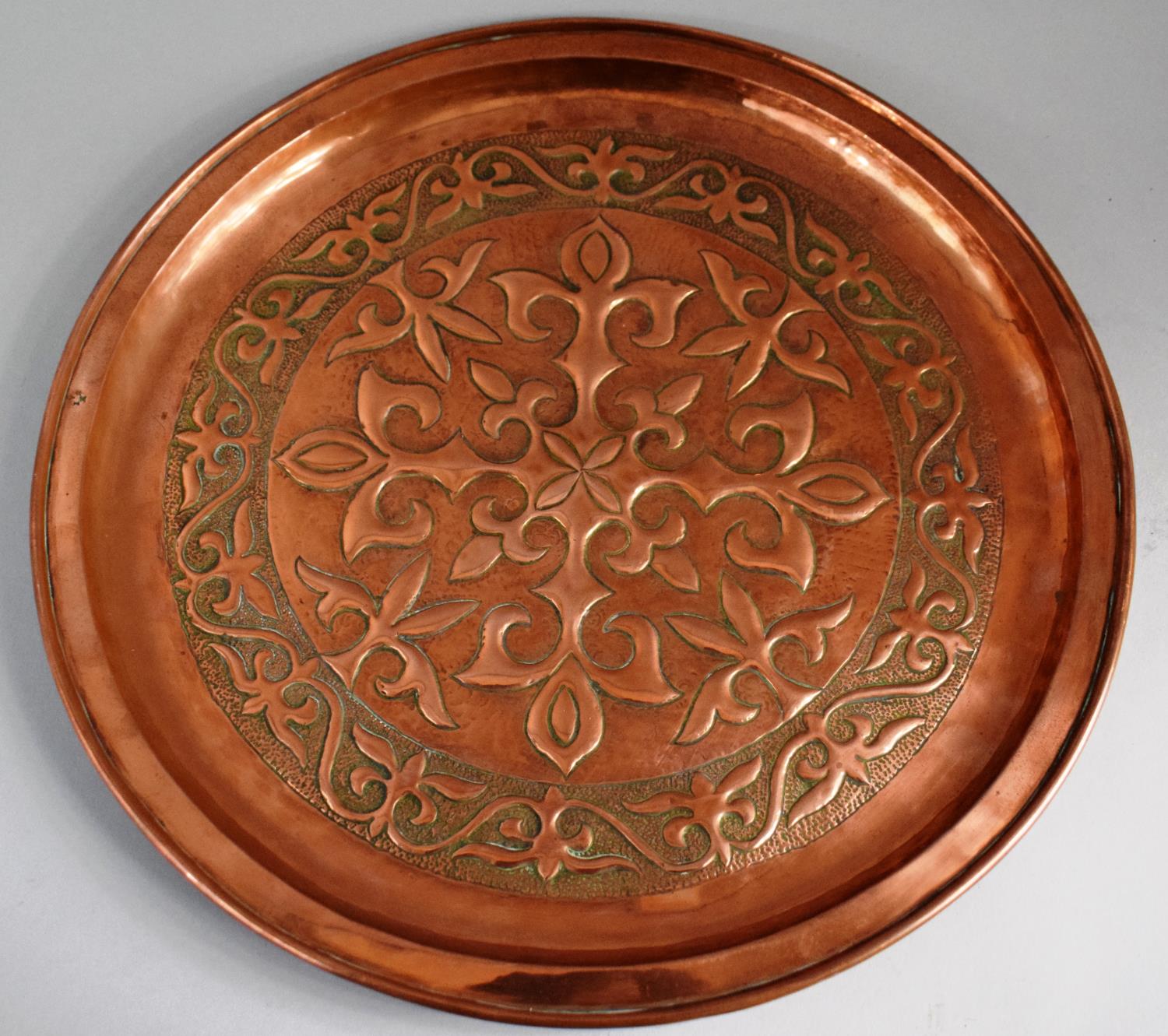 A Keswick School of Arts Circular Copper Charger Decorated with Fleur De Lys Design, Stamped with