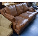 A Leather Upholstered Three Seater Settee