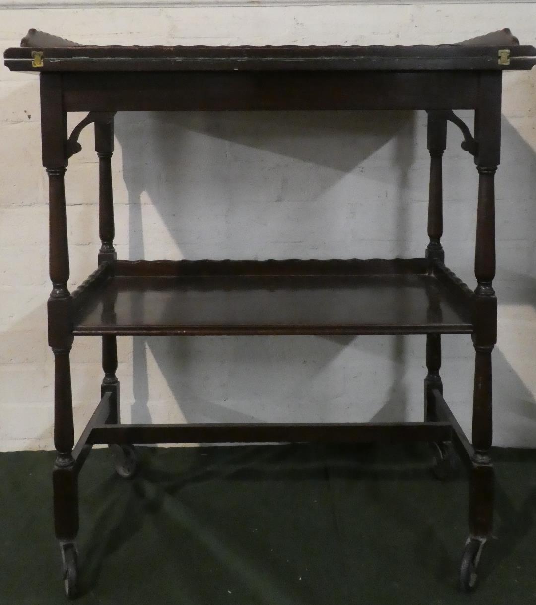 An Edwardian Mahogany Two Tier Galleried Tea Trolley/Games Table with Lift and Twist Top Having