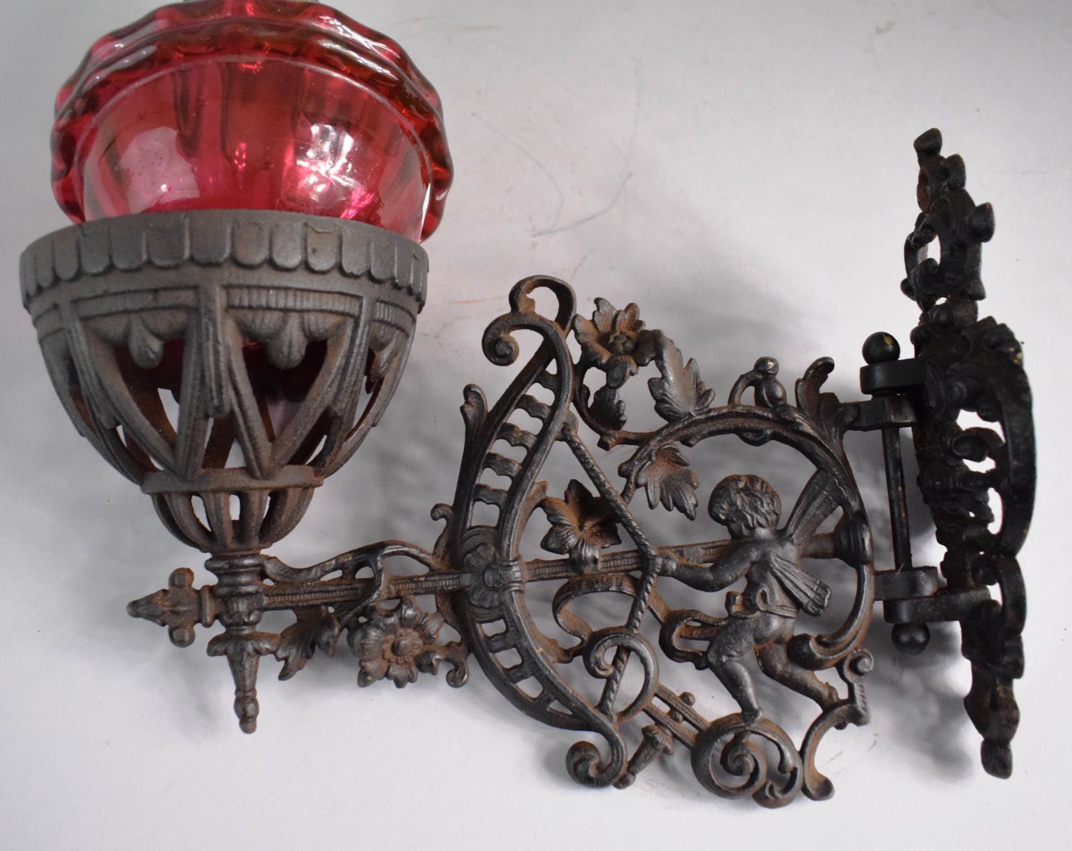 A Victorian Pierced Metal Wall Mounting Oil Lamp Holder Complete with Lamp Having Cranberry Glass - Image 2 of 3