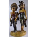 A Carved Wooden Balinese Figure Group Depicting Husband and Wife, 53cm High