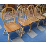A Set of Four Mid 20th Century Ercol Spindle Back Kitchen Chairs, legs pet damaged