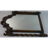 An Edwardian Oak Framed Wall Mirror with Barley Twist Supports, 70cm high