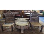 A Pair of Ornately Carved and Pierced Indian Side Chairs with Carved Circular Wooden Frame Housing