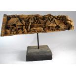 A Indonesian Carved Wooden Study of Coastal Village Scene with Figure, Water Buffalo and Coconut