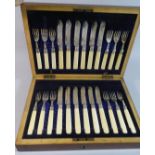 An Edwardian Mahogany Cased Set of Twelve Silver and Bone Handled Fruit Knives and Forks,