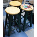 A Set of Three Green Painted Circular Topped Stools, One with Painted Decoration, 60cm High