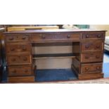 A Stained Pine and Mahogany Kneehole Desk with Long Centre Drawer Flanked by Two Short Drawers and