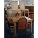 A Modern Extending Dining Table with Four Plus Two Chairs