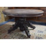 A Continental Oak Oval Topped Table on Heavily Carved Base, 130cm Wide