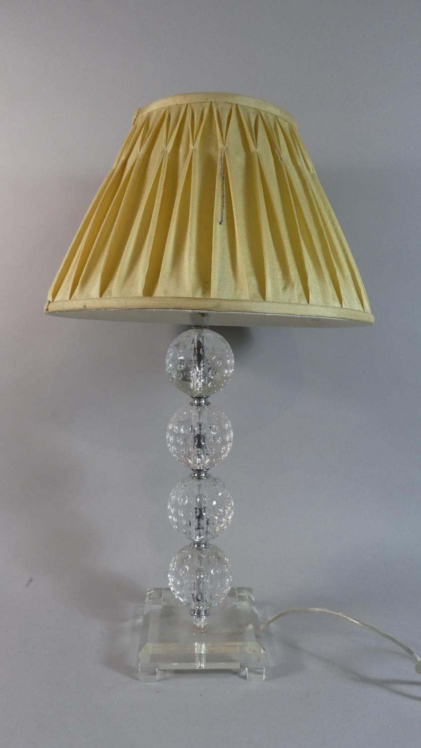 A Modern Chrome and Glass Table Lamp and Shade with the Support in the Form of Four Golf Balls, 61cm