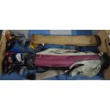 A Vintage Canvas Golf Bag Containing More Modern Clubs and a Set of Golf Clubs and Bag