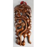 A Carved Far Eastern Hardwood Pierced Wall Hanging Decorated with Stylised Fruit and Flowers, 44cm