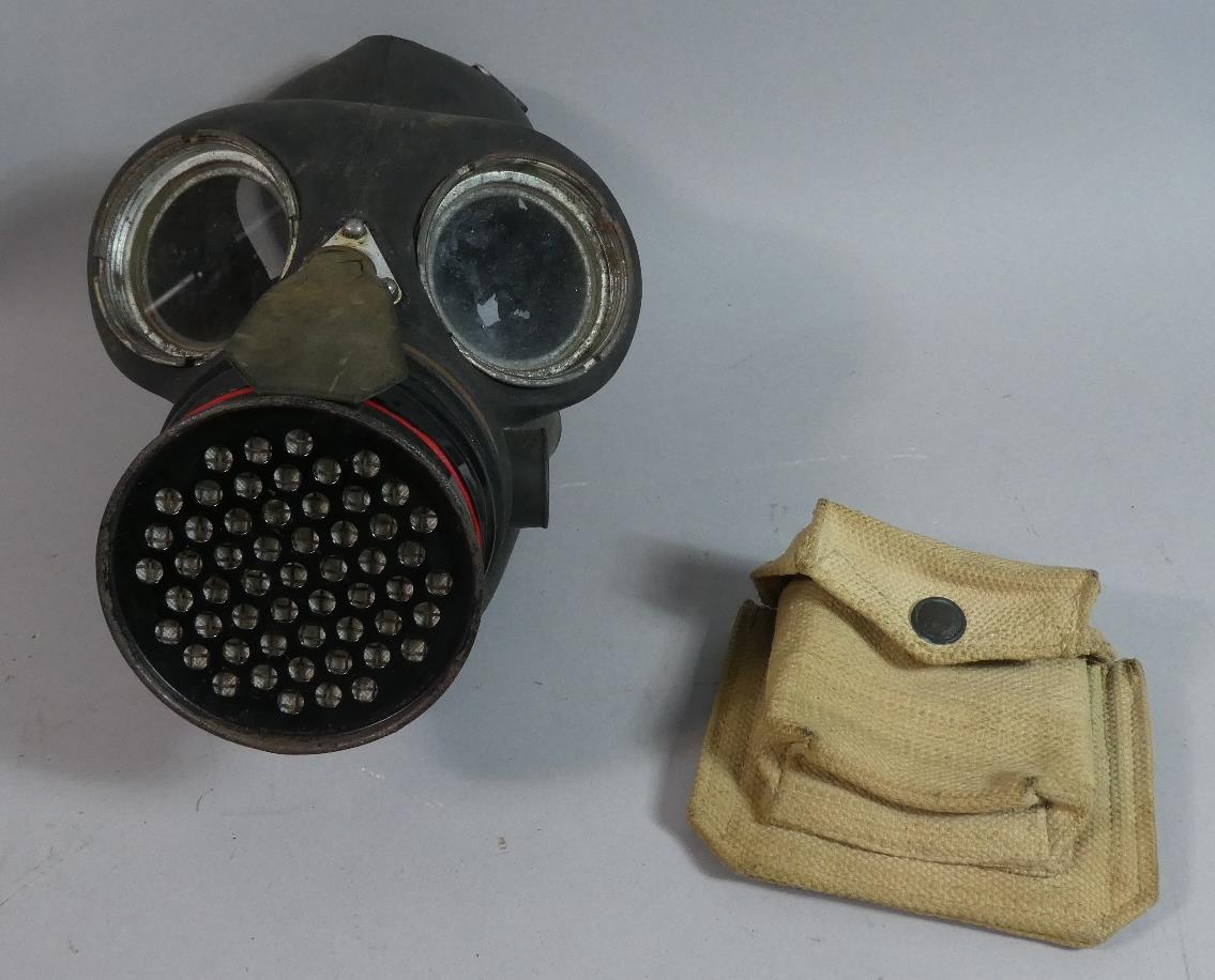 A WWII Gas Mask and Canvas Ammo Pouch