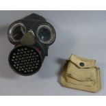 A WWII Gas Mask and Canvas Ammo Pouch