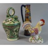 A Glazed Terracotta Wine Jug, Hen Ornament and Tapering Jug