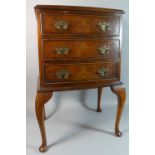 A Small Modern Walnut Bow Fronted Chest of Three Drawers on Extended Mahogany Supports, 47cm Wide