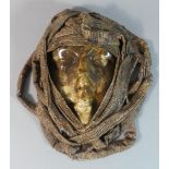 A Ceramic and Stiffened Cloth Wall Mask of Arabic Girl, 27cm High